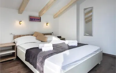 Krevet ili kreveti u jedinici u objektu Three-Bedroom Holiday Home In Suhi Potok