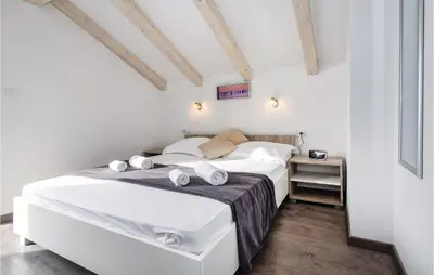 Krevet ili kreveti u jedinici u objektu Three-Bedroom Holiday Home In Suhi Potok