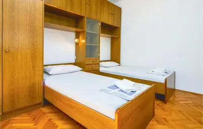 Krevet ili kreveti u jedinici u objektu Three-Bedroom Apartment In Podstrana