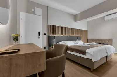 Krevet ili kreveti u jedinici u objektu Beach Hotel Božikovina