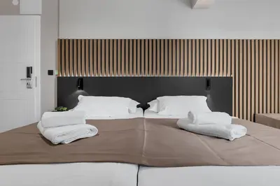 Krevet ili kreveti u jedinici u objektu Beach Hotel Božikovina