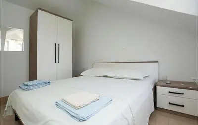 Krevet ili kreveti u jedinici u objektu Three-Bedroom Holiday Home In Pucisca