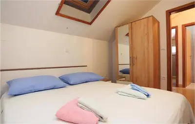 Krevet ili kreveti u jedinici u objektu Three-Bedroom Holiday Home In Pucisca