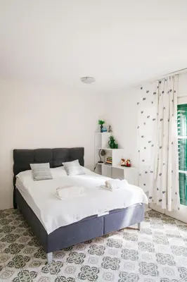 Krevet ili kreveti u jedinici u objektu Charming apartments with garden