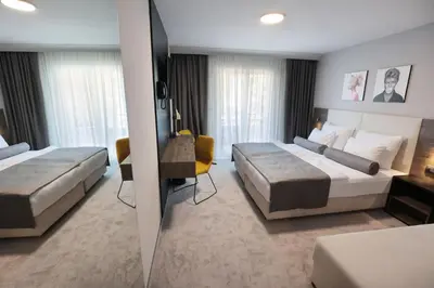 Krevet ili kreveti u jedinici u objektu Hotel Milenij