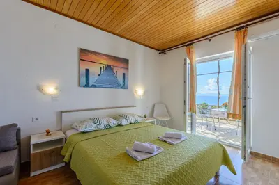 Krevet ili kreveti u jedinici u objektu Rooms Sani