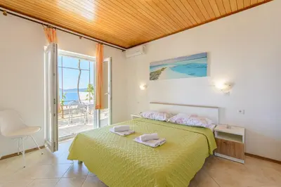 Krevet ili kreveti u jedinici u objektu Rooms Sani