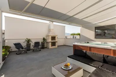 TV i/ili zabavni centar u objektu Sea Pearl Luxury Apartment