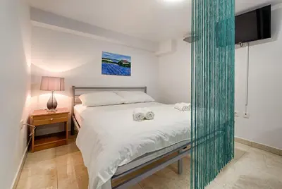 Krevet ili kreveti u jedinici u objektu Cezar Luxury Apartment