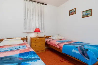 Krevet ili kreveti u jedinici u objektu Apartments by the sea Pisak, Omis - 15177