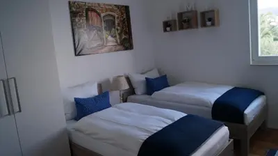 Krevet ili kreveti u jedinici u objektu Schönes Ferienhaus direkt am Meer
