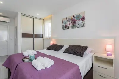 Krevet ili kreveti u jedinici u objektu Apartments Villa 19