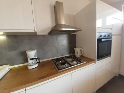 Kuhinja ili čajna kuhinja u objektu Penthouse studio with sea view