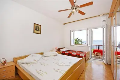 Krevet ili kreveti u jedinici u objektu Apartments by the sea Dugi Rat, Omis - 7575