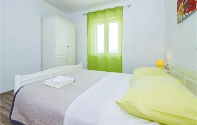 Krevet ili kreveti u jedinici u objektu Three-Bedroom Holiday Home In Stanici
