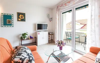 TV i/ili zabavni centar u objektu Two-Bedroom Apartment In Makarska