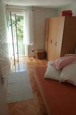 Krevet ili kreveti u jedinici u objektu Apartments by the sea Omis - 15485