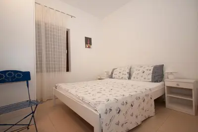 Krevet ili kreveti u jedinici u objektu Rooms & Apartments Bruno
