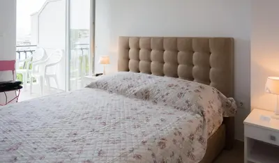 Krevet ili kreveti u jedinici u objektu Rooms & Apartments Bruno