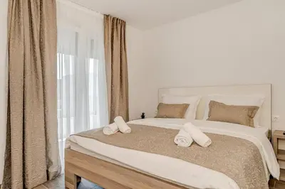 Krevet ili kreveti u jedinici u objektu Villa Ivo Apartmani