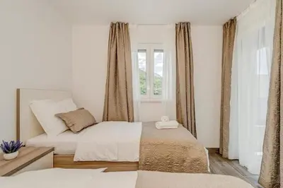 Krevet ili kreveti u jedinici u objektu Villa Ivo Apartmani
