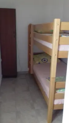Krevet ili kreveti u jedinici u objektu APARTMANI LAŠTRO