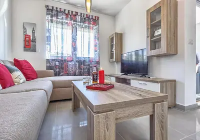 TV i/ili zabavni centar u objektu Sweetime Apartment in Podstrana