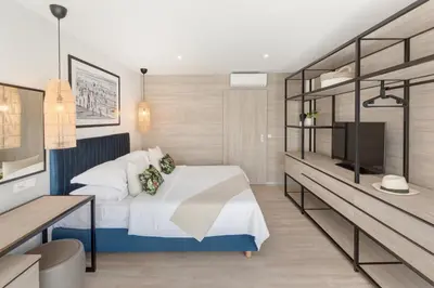 Krevet ili kreveti u jedinici u objektu Gava Waterman Island Cottages - All Inclusive