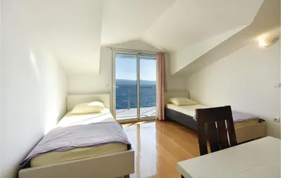 Krevet ili kreveti u jedinici u objektu Two-Bedroom Apartment In Stanici