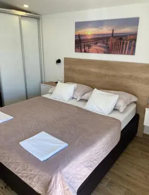 Krevet ili kreveti u jedinici u objektu Apartments SKY