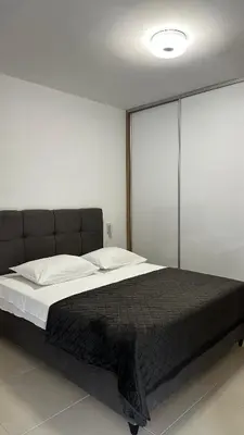 Krevet ili kreveti u jedinici u objektu Apartments & Rooms Prižmić Split