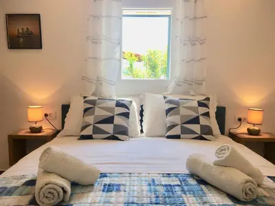 Krevet ili kreveti u jedinici u objektu Paradise Stone Apartments