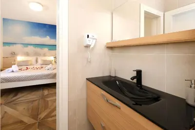 Krevet ili kreveti u jedinici u objektu Apartments REDSTONE luxury apartments