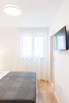 TV i/ili zabavni centar u objektu Lion's Beach Apartment