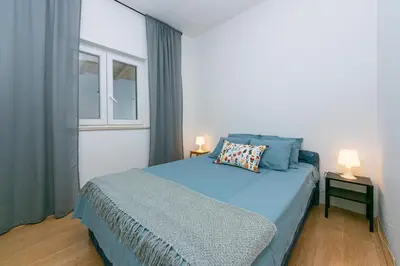 Krevet ili kreveti u jedinici u objektu Apartments by the sea Pisak, Omis - 1008