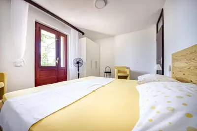 Krevet ili kreveti u jedinici u objektu Apartments and Rooms Ref
