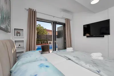 Krevet ili kreveti u jedinici u objektu Lulani Makarska pool apartment