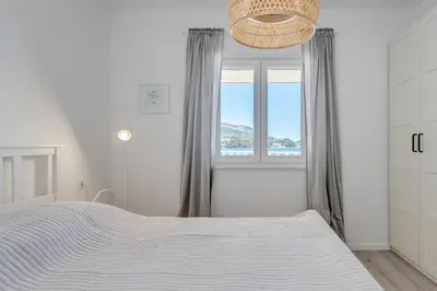 Krevet ili kreveti u jedinici u objektu Beachfront apartments