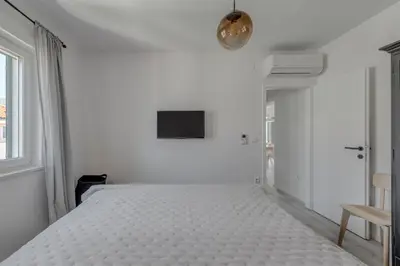 Krevet ili kreveti u jedinici u objektu Beachfront apartments