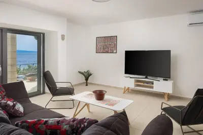 TV i/ili zabavni centar u objektu Absolute Beach Villa