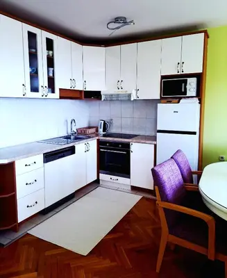 Kuhinja ili čajna kuhinja u objektu Family Apartment Green with a sea view and a free parking