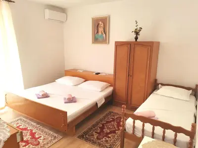 Krevet ili kreveti u jedinici u objektu Sobe Centar Baška Voda