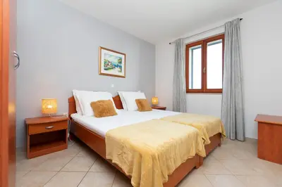 Krevet ili kreveti u jedinici u objektu Apartments Ljiljana