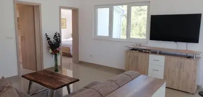 TV i/ili zabavni centar u objektu Apartment Penthouse by the sea