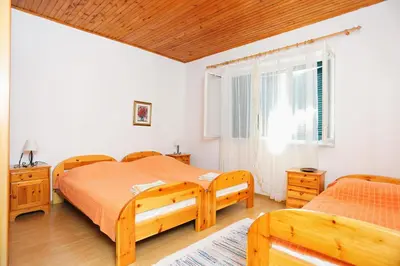 Krevet ili kreveti u jedinici u objektu Apartments by the sea Sumpetar, Omis - 17810