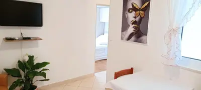 TV i/ili zabavni centar u objektu Apartments Grgo