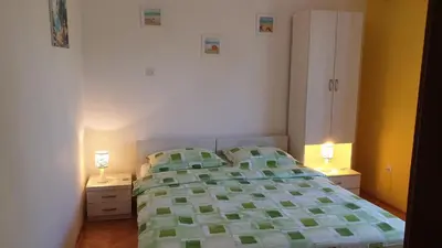 Krevet ili kreveti u jedinici u objektu Apartments and Rooms Dobrila