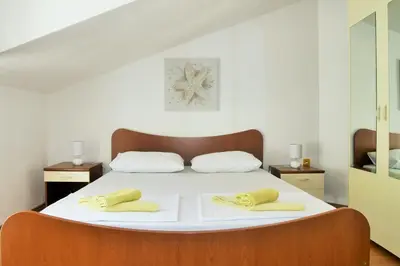Krevet ili kreveti u jedinici u objektu Apartments Sandy Beach
