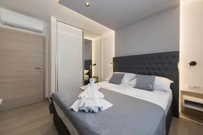 Krevet ili kreveti u jedinici u objektu Delux Apartments Sunset Beach