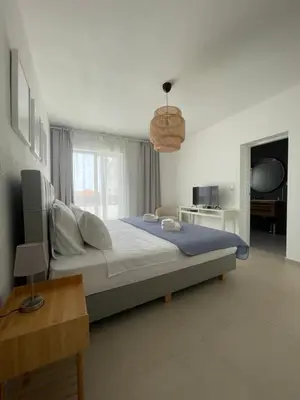 Krevet ili kreveti u jedinici u objektu Exclusive 2 Bedroom Seafront Suite with jacuzzi